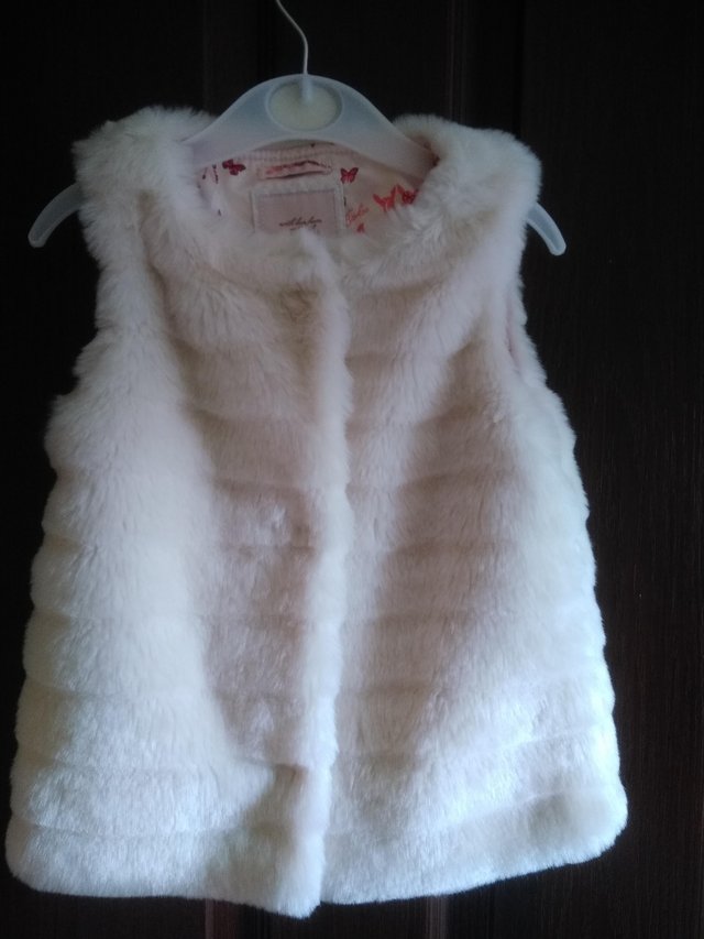Preview of the first image of Girl's fur gillet by Ted Baker Age 4-5.