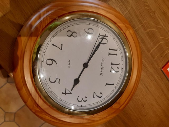 Preview of the first image of Round Wall Clock, Pine looking.