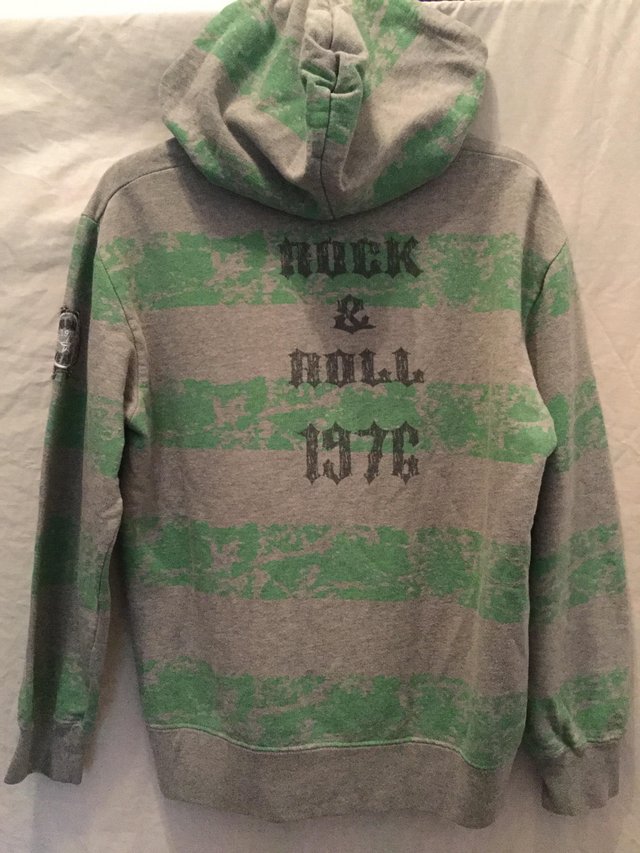 Image 2 of A grey, green casual hoody with motifs