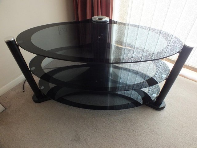 Preview of the first image of Oval Glass TV Stand Smoked Glass.