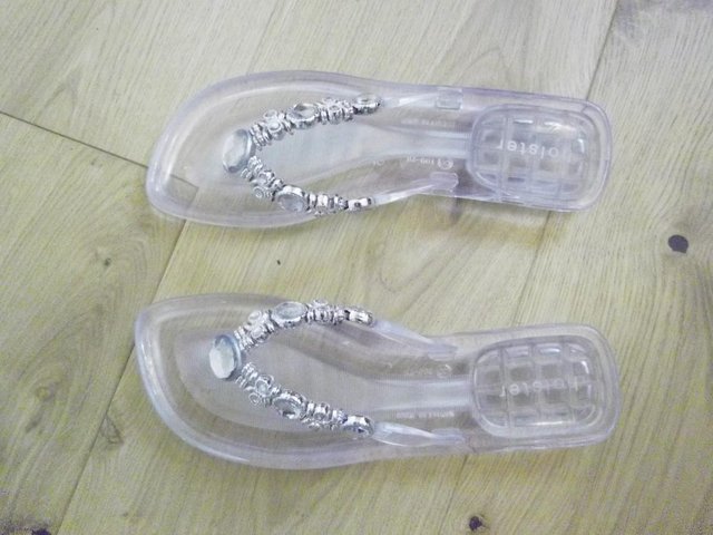 Preview of the first image of Holster Jelly Brand Clear Slip-on Sandals.
