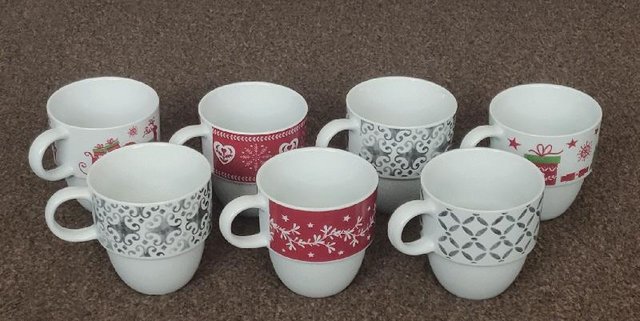 Preview of the first image of 7 Assorted Stacking Coffee Mugs.