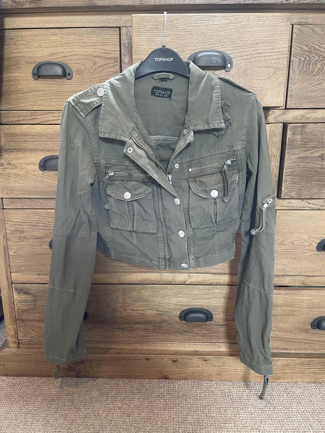 Preview of the first image of Vintage Topshop khaki crop jacket with zips.