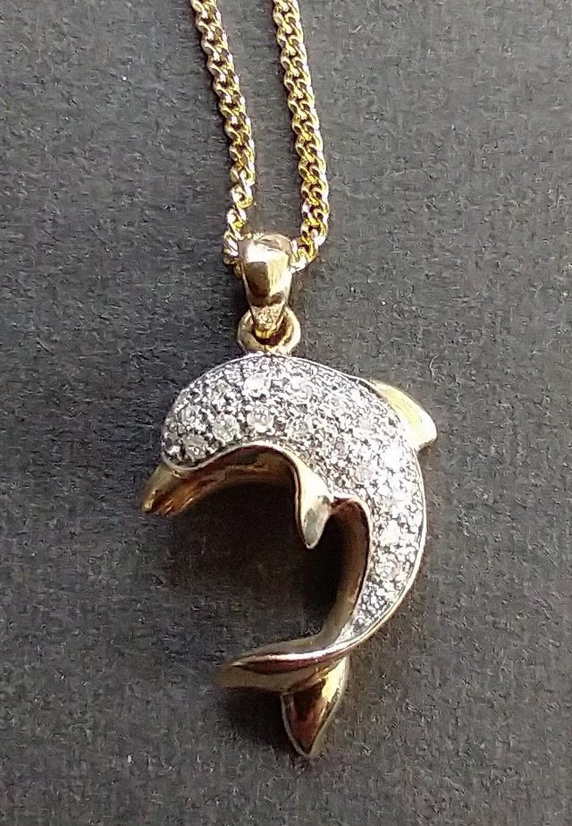 Preview of the first image of GOLD & DIAMOND DOLPHIN PENDANT.