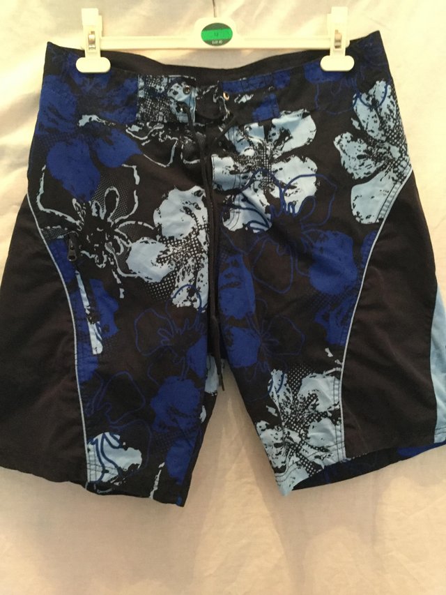 Preview of the first image of Brightly patterned board shorts.