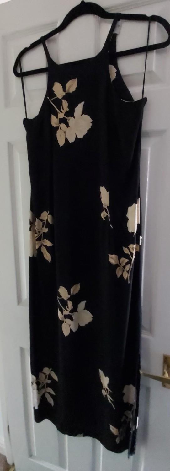 Preview of the first image of Black Maxi Dress with Floral Pattern.
