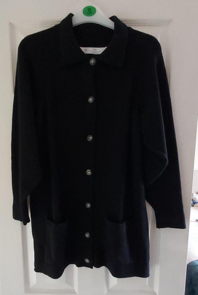 Preview of the first image of Black Lambswool Buttoned Cardigan..