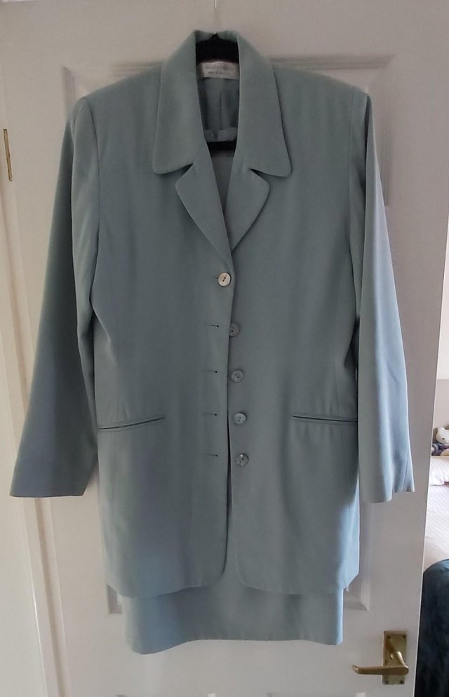 Preview of the first image of Light Green Sleeveless Shift Dress and Jacket Suit..