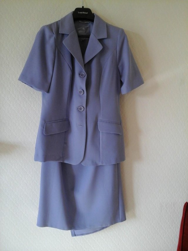 Preview of the first image of 2-Piece Lilac Lightweight Jacket and Wraparound Skirt.
