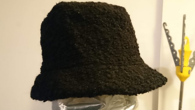 Preview of the first image of New Black slight boucle bucket hat.