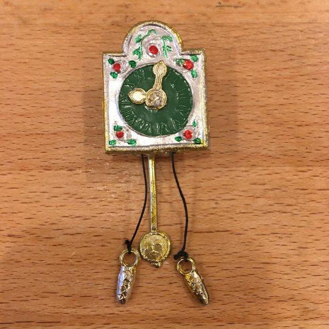 Preview of the first image of Dolls house metal hanging pendulum clock.