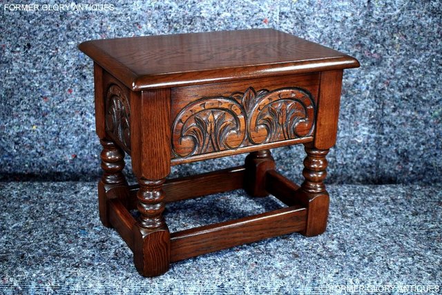 Preview of the first image of AN OLD CHARM TUDOR BROWN CARVED OAK SLIPPER BOX SEWING CHEST.