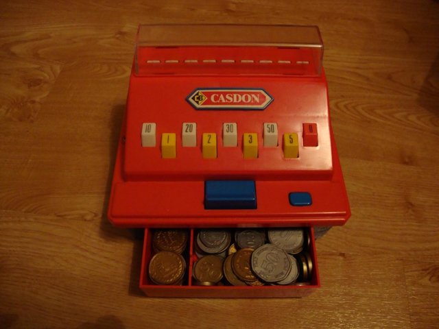 Preview of the first image of Toy red cash register with money.