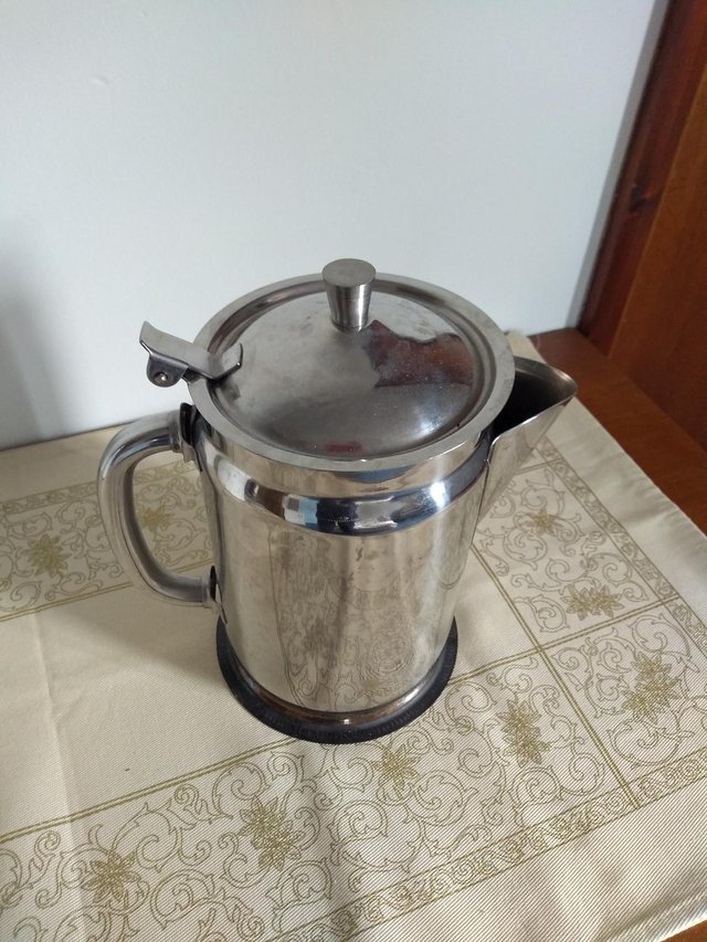 Preview of the first image of unusual vintage stainless steel jug.