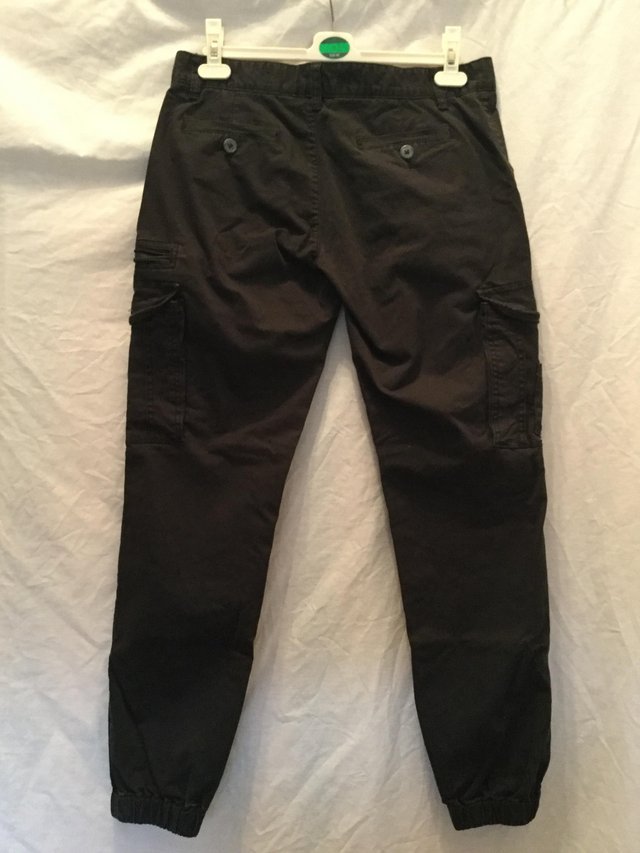Preview of the first image of Black Jacob cargo pants by Henleys.