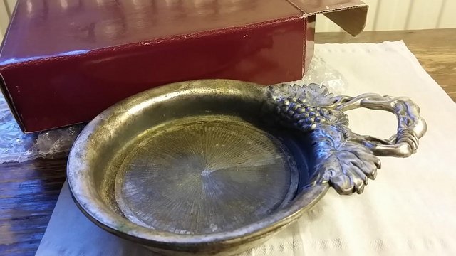 Preview of the first image of Pewter wine bottle holder / trinket dish.