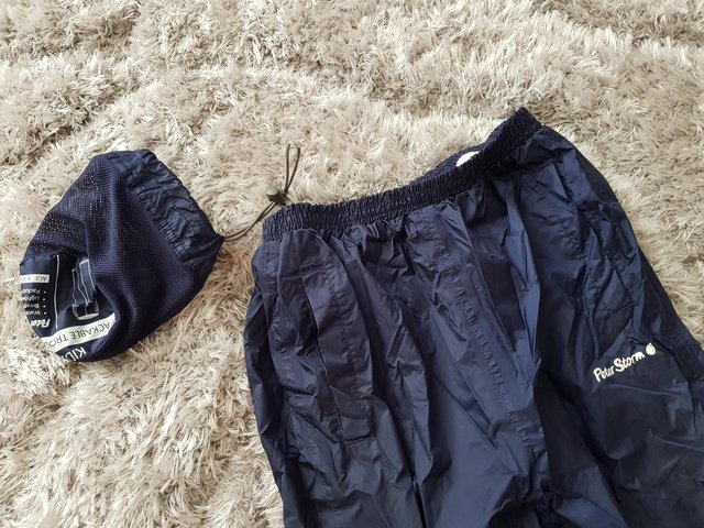 Preview of the first image of Packable Peter Storm waterproof trousers age 9-10 years.