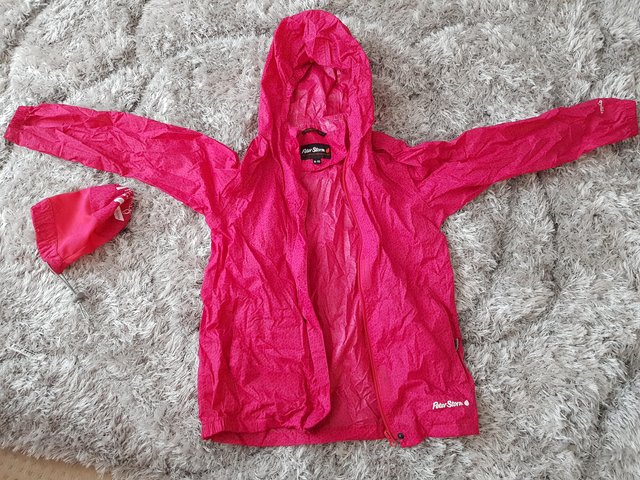 Preview of the first image of Peter Storm pink rain coat waterproof jacket age 9-10.