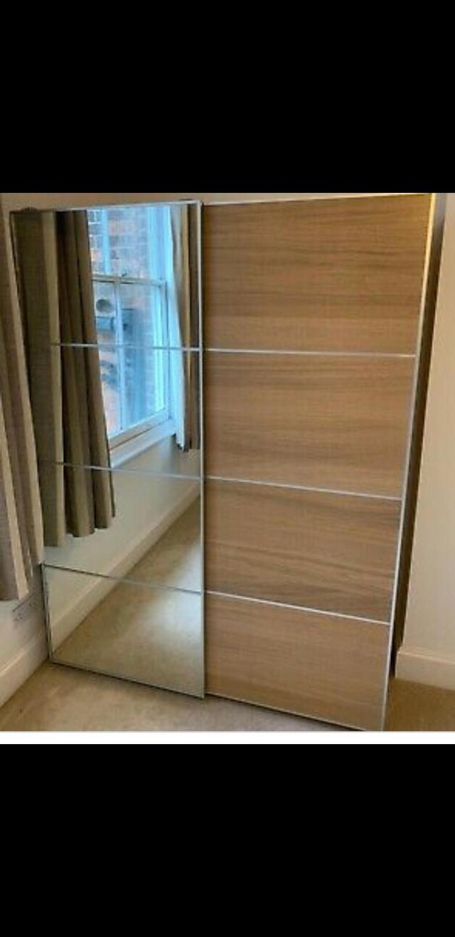 Preview of the first image of Large Ikea Pax Wardrobe With Mirror Sliding doors.