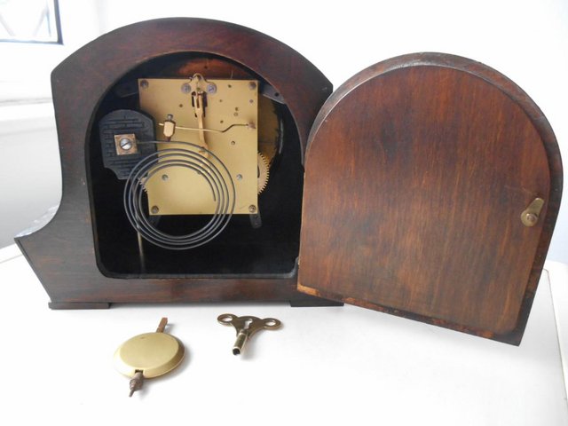 Image 3 of An English striking mantle clock with plaque.