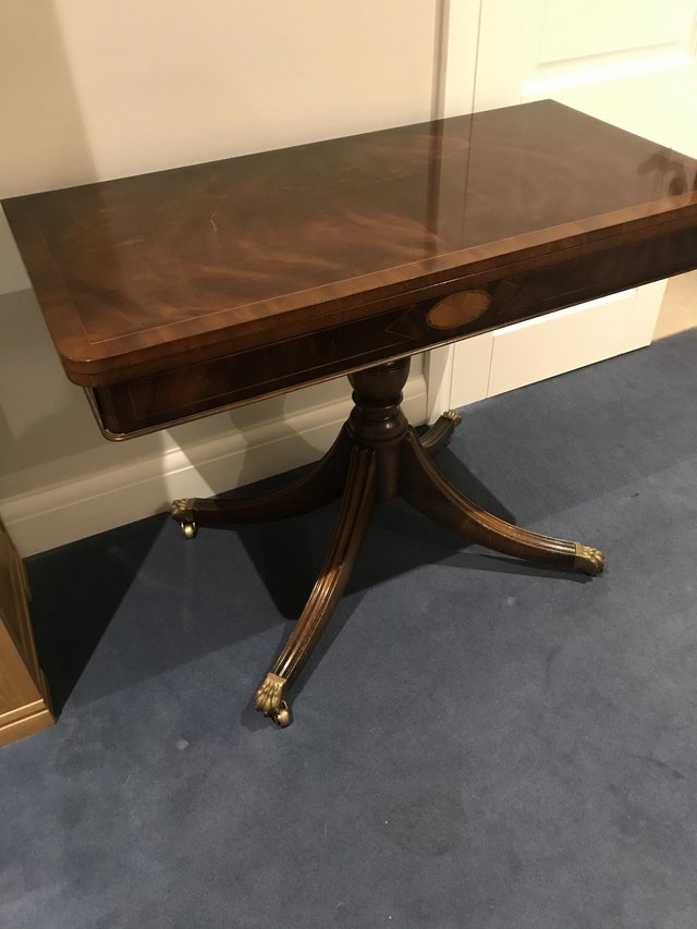 Preview of the first image of Reproduction mahogany tea/card table.