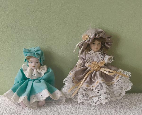 Preview of the first image of 2 Beautiful Porcelain Miniature Dolls.