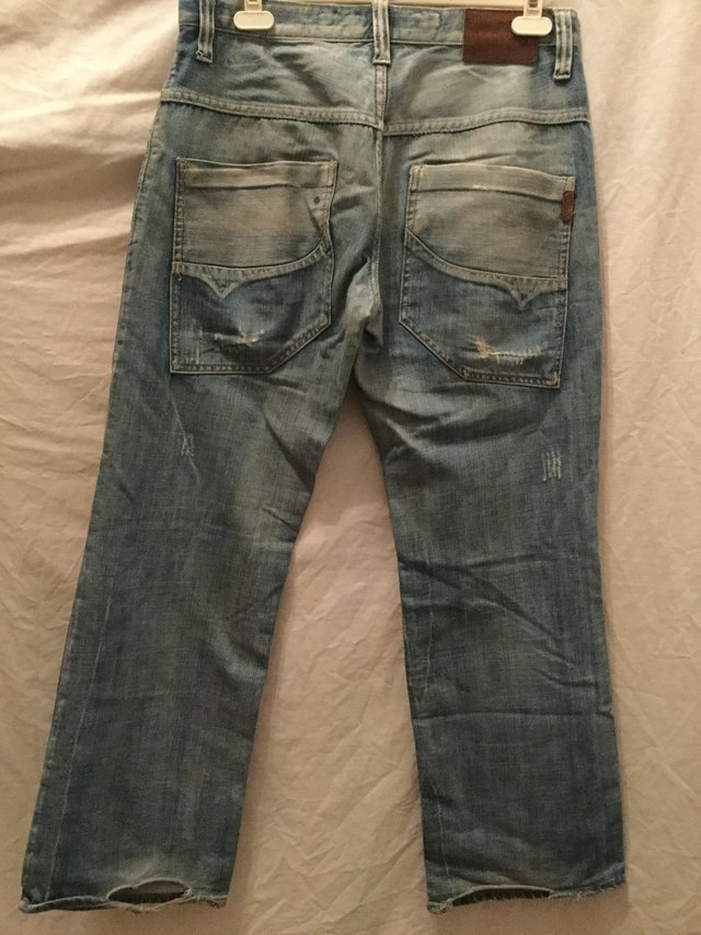 Preview of the first image of Voi faded and distressed jeans.