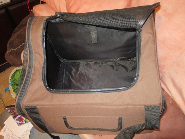 Preview of the first image of Dog or cat carrier with handles and shoulder strap.