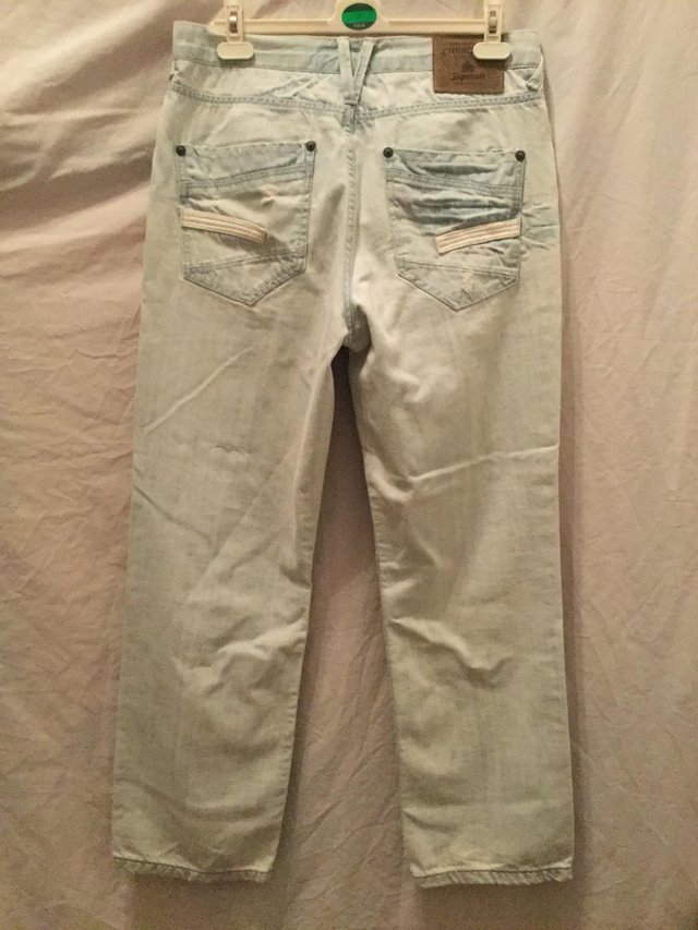 Preview of the first image of Cherokee washed light blue distressed jeans.
