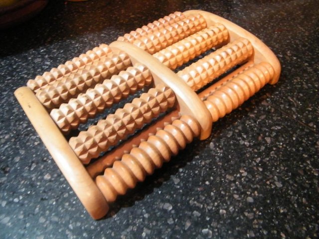 Preview of the first image of WOODEN FOOT MASSAGER ,,FIVE ROLLER.
