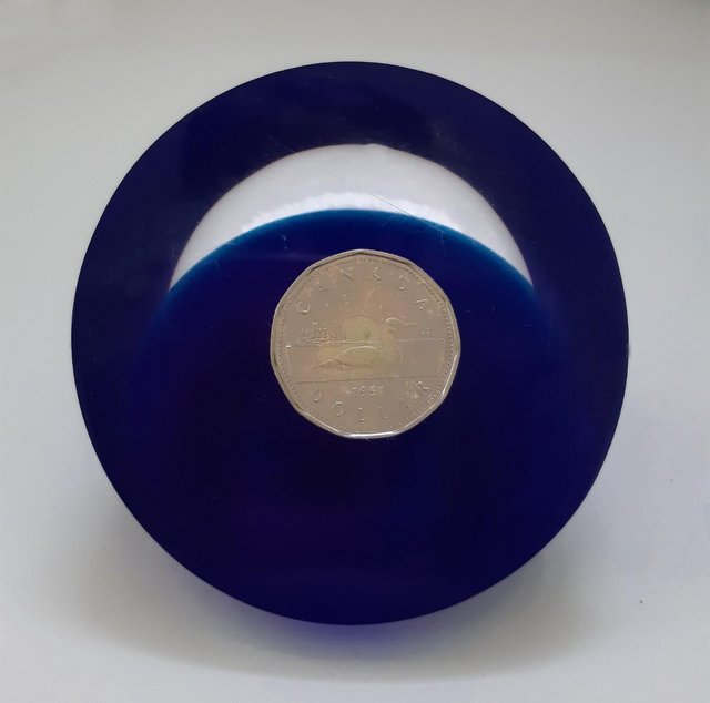 Preview of the first image of Vintage 1991 Cobalt Blue Canada Dollar Paperweight   BX31.