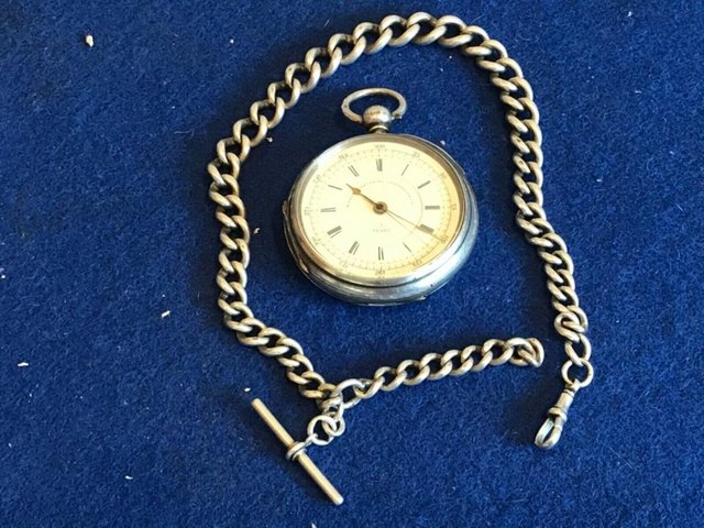 Preview of the first image of Silver cased chronograph key wind pocket watch + chain.