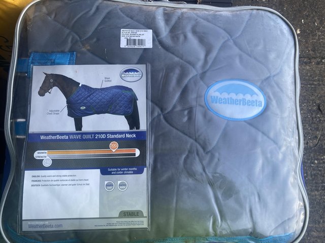 Preview of the first image of BNWT Weatherbeeta stable rug 6’3”.