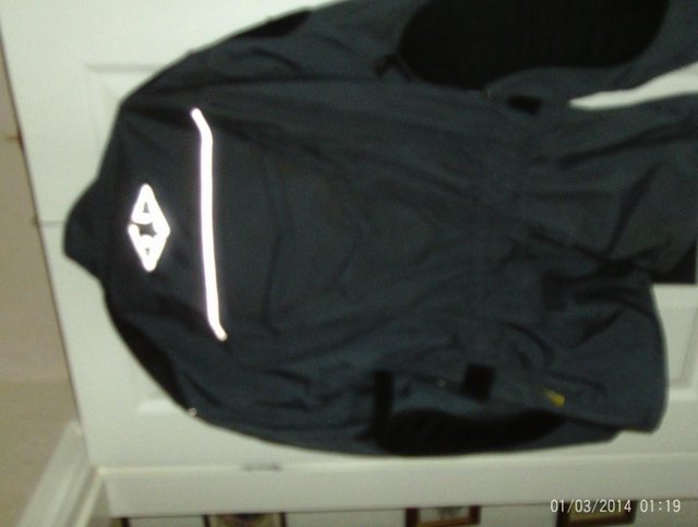 Preview of the first image of motor bike jacket dark grey and black.