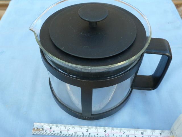 Preview of the first image of Glass jug with plastic handle and lid.