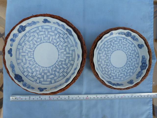 Preview of the first image of Ornamental plates on fine wicker bases.