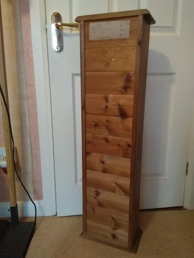 Image 2 of Tall, dark stained, pine storage unit