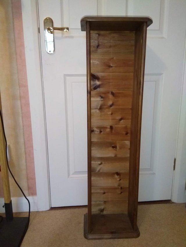 Image 3 of Tall, dark stained, pine storage unit
