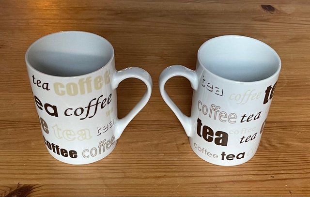 Preview of the first image of PAIR OF TALL MATCHING TEA/COFFEE MUGS.
