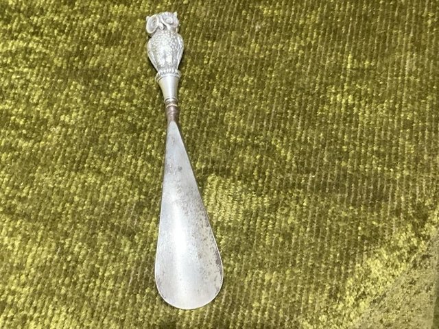 Preview of the first image of Silver owl double side heads shoehorn.