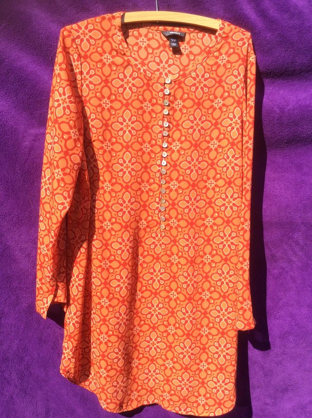 Preview of the first image of Retro orange patterned tunic top.