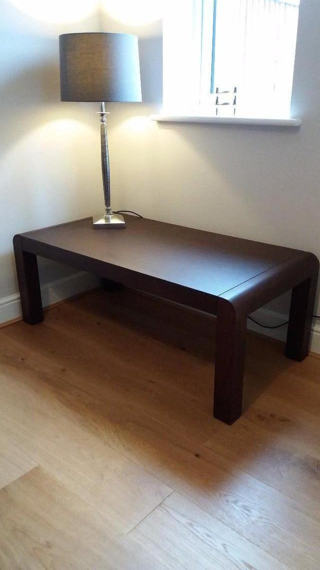 Preview of the first image of John Lewis Coffee Table Dark wood satin.
