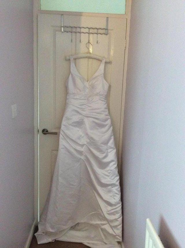 Preview of the first image of New white empire line wedding dress.