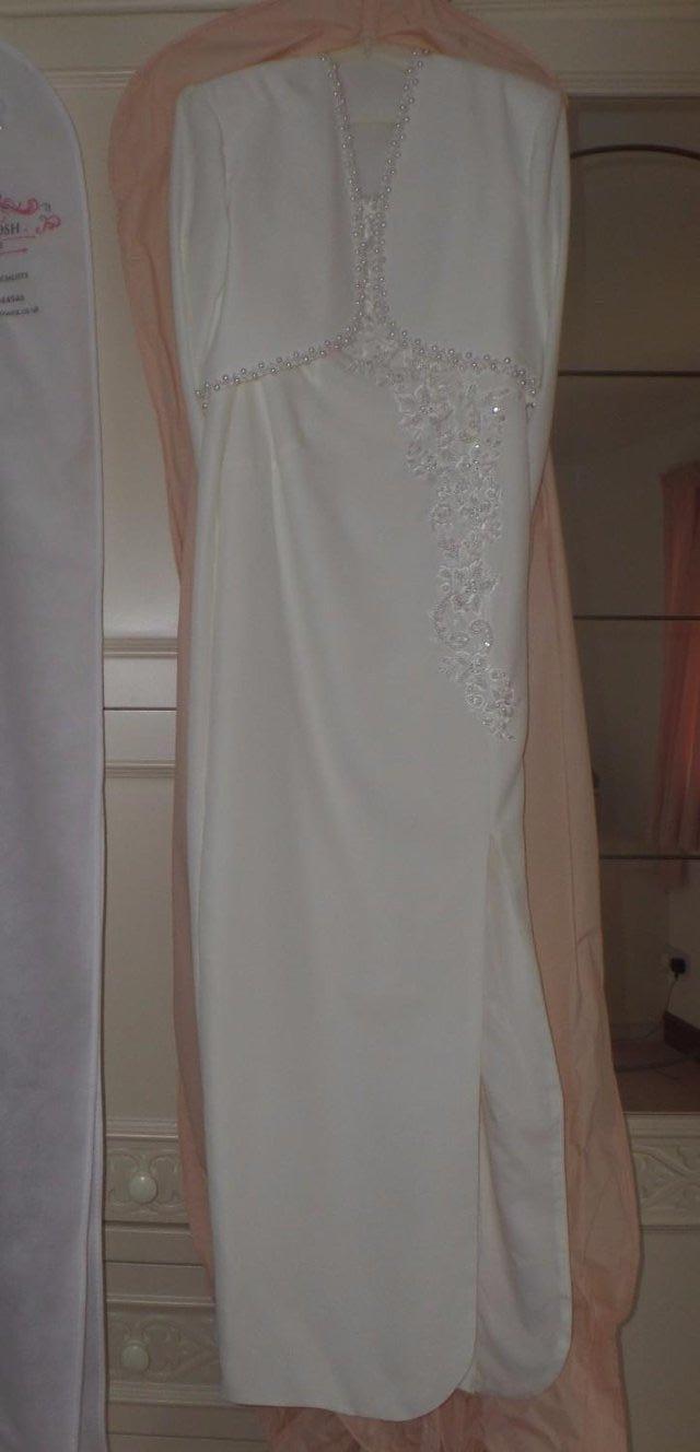Preview of the first image of Cream wedding or prom dress with matching bolero jacket.