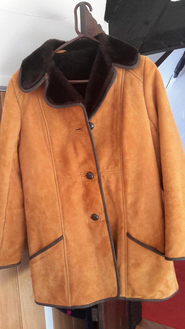 Preview of the first image of Fabulous cosy Sheepskin coat size 16.