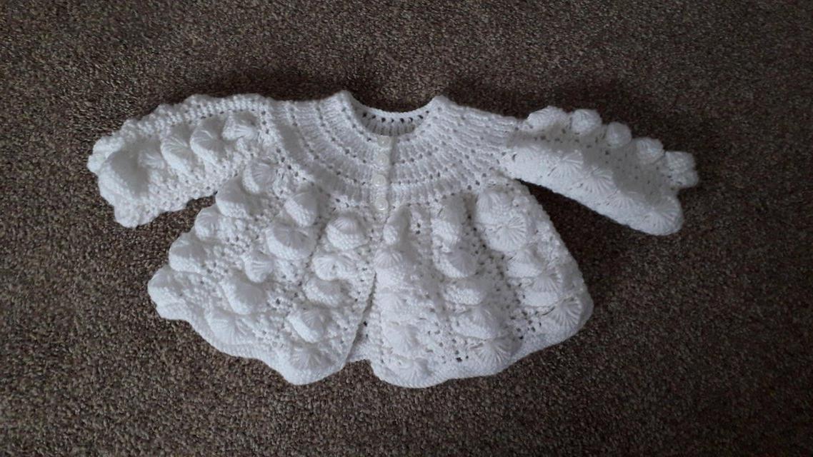 Preview of the first image of Knitted baby matinee jackets and cardigans, many styles.
